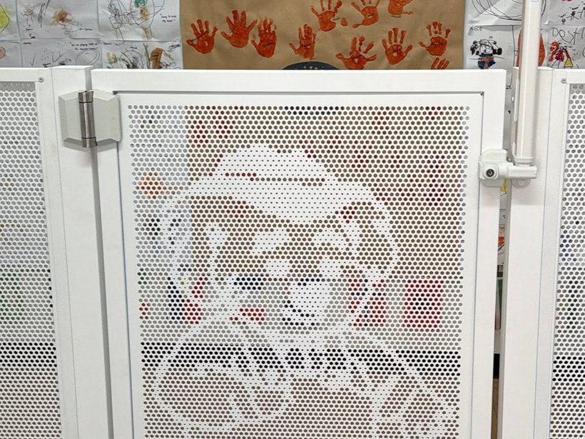 White koala-pattern Perf Safe gate at a childcare centre entrance